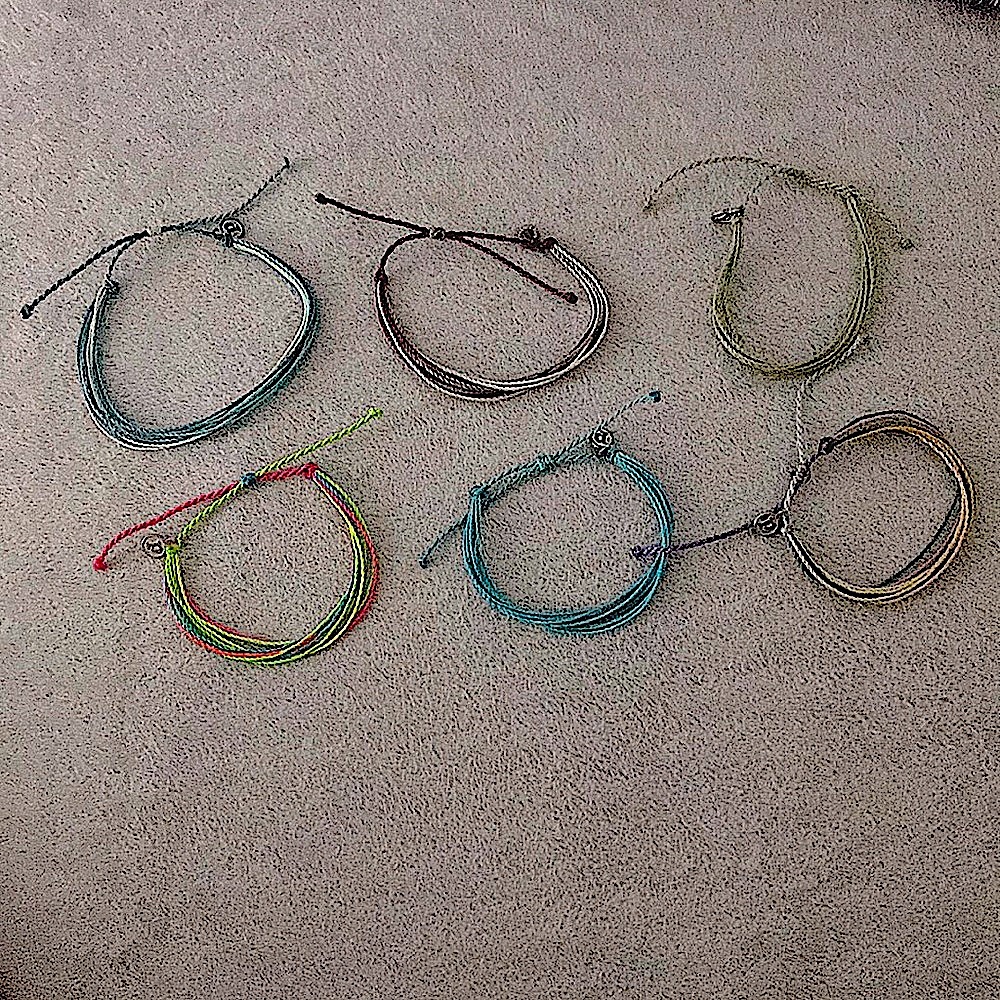 6 brand new not used Puravida bracelets